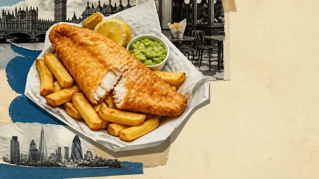 Man excitedly holding a plate of fish and chips in a London street with historic buildings and a red telephone box behind him