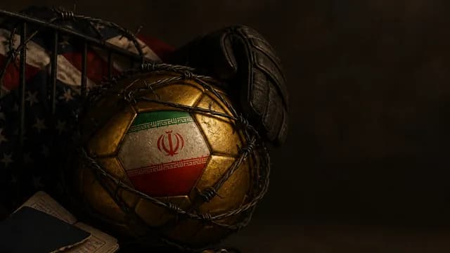 Iranian national football team in white jerseys stands behind a portrait of a political figure against a stadium…