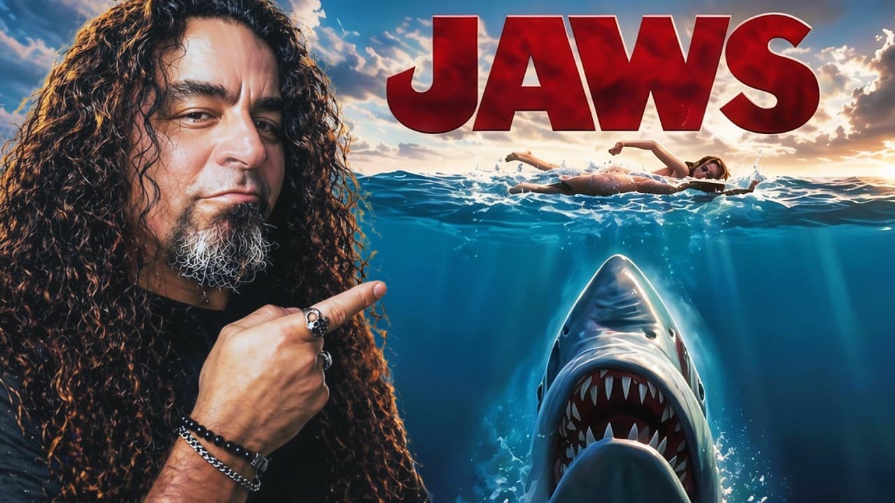 Man with long curly hair pointing at animated Jaws poster with swimming person and great white shark with glowing teeth