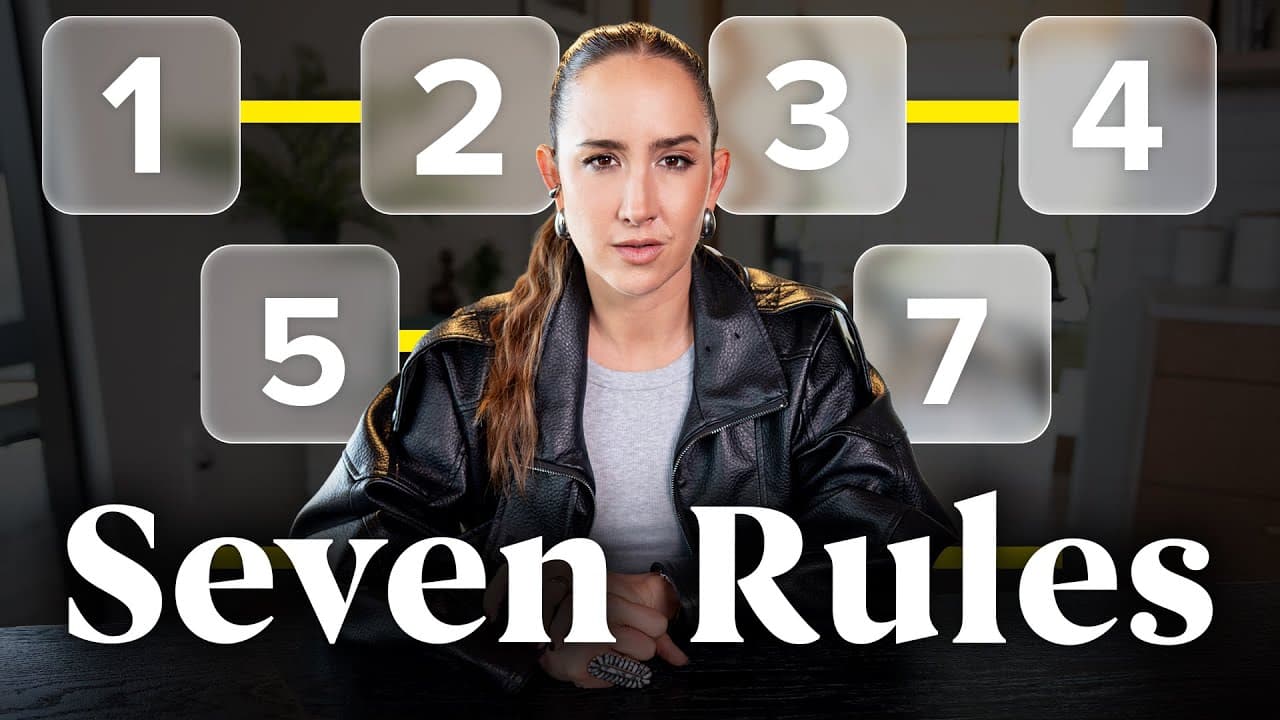 Woman in black leather jacket seated at desk with numbered boxes 1-7 surrounding her head against blurred indoor background