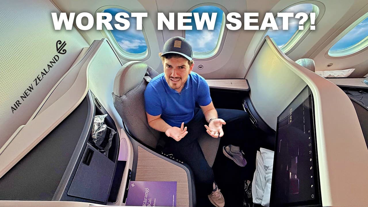 A man in a blue shirt sits in an airplane seat with the caption "WORST NEW SEAT?!" displayed above him in an Air New…
