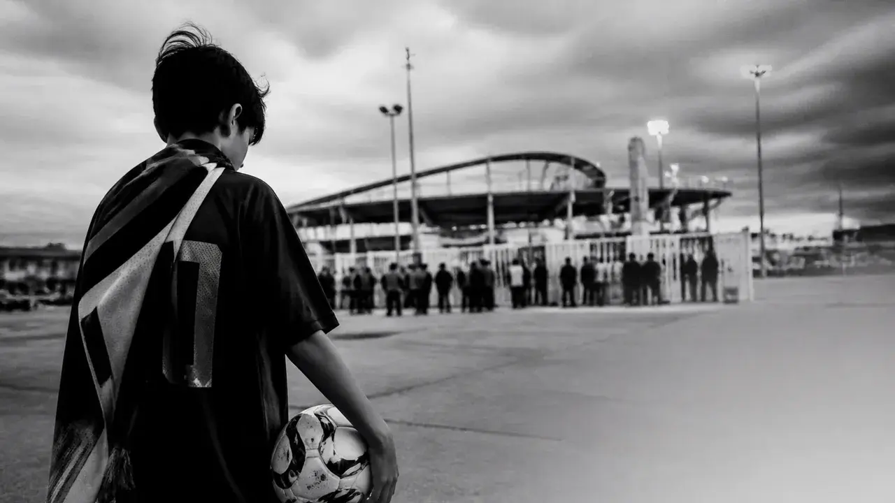 Hand holding a FIFA World Cup 2026 ticket priced at $22,316.90 with stadium seating chart visible in background